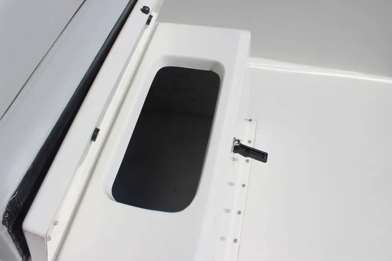 Slide: The Image of 2019 Bay Rider 2060 Skiff storage compartment with open lid and latch. - 18