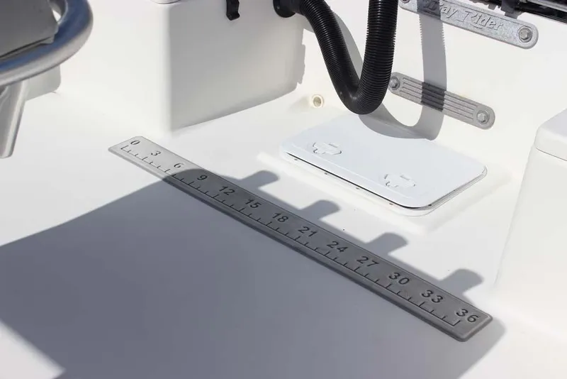 Slide: The Image of 2019 Bay Rider 2060 Skiff interior with measurement scale and storage compartment. - 22