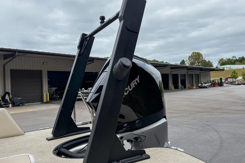 Slide: The Image of Alera M23L 2026 boat with Mercury engine at a marina under cloudy skies. - 4