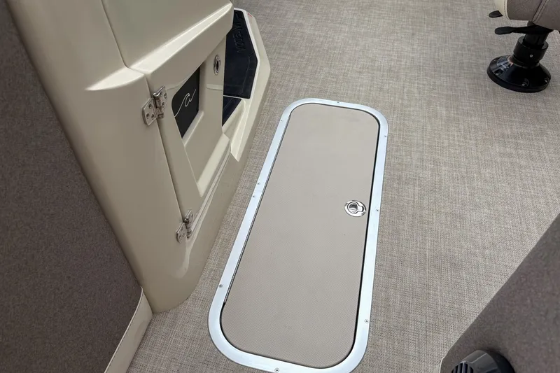 Slide: The Image of Alera M23L 2026 boat interior with storage compartment and seating. - 9