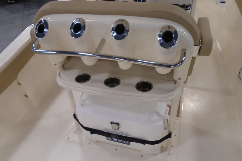 Slide: The Image of 2026 Scout 240 XSF boat interior with rod holders and cooler storage. - 29