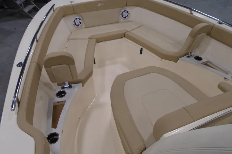 Slide: The Image of 2026 Scout 240 XSF boat interior with beige seating and stainless steel accents. - 38