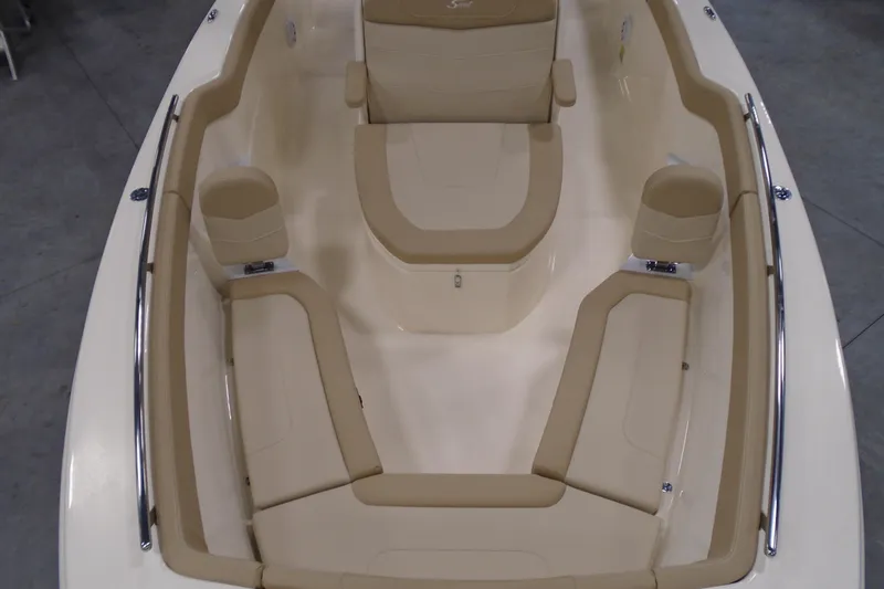 Slide: The Image of 2026 Scout 240 XSF boat interior with beige seating and stainless steel railings. - 42