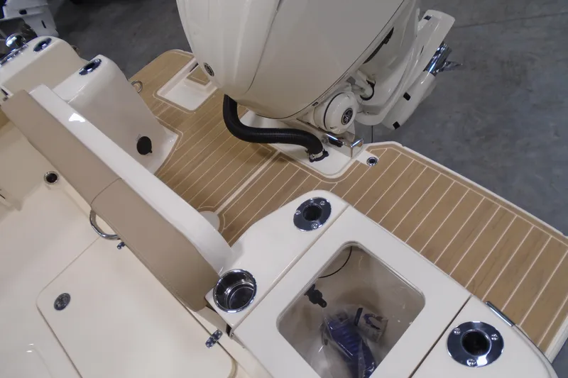 Slide: The Image of 2026 Scout 240 XSF boat deck with seating and motor, featuring modern design elements. - 51