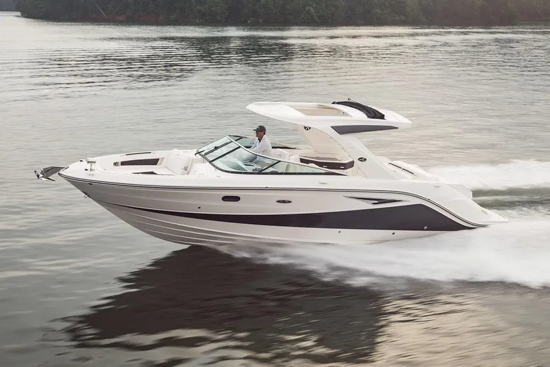 Slide: The Image of Manufacturer Provided Image: 2023 Sea Ray SLX 310 boat cruising on a calm lake. - 41