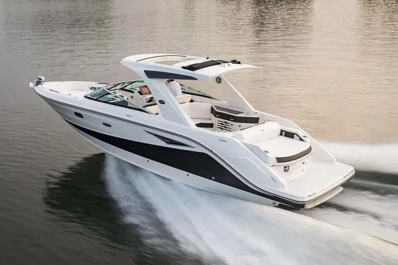 Slide: The Image of Manufacturer Provided Image: 2023 Sea Ray SLX 310 luxury motorboat cruising on water. - 42