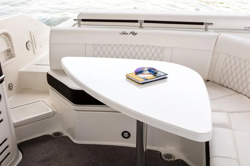 Slide: The Image of 2023 Sea Ray SLX 310 boat interior with luxurious seating and sleek design. - 9