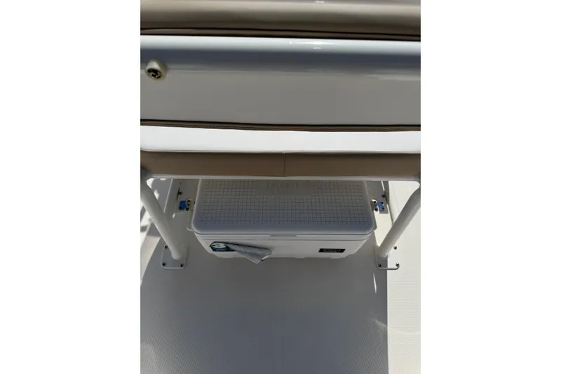 Slide: The Image of 2026 Robalo R160 Center Console boat interior with storage compartment. - 10
