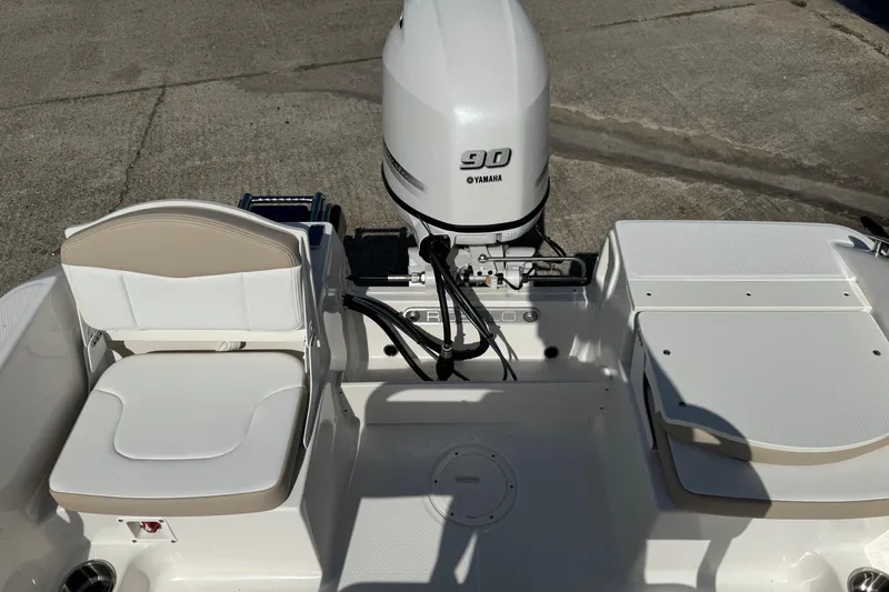 Slide: The Image of 2026 Robalo R160 Center Console boat with Yamaha 90 engine, rear seating view. - 8