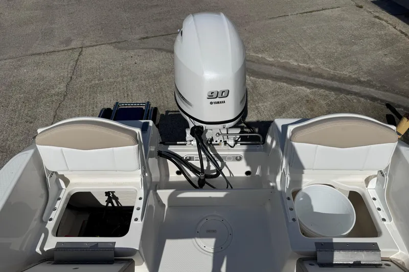 Slide: The Image of 2026 Robalo R160 Center Console boat with Yamaha 90 engine, rear seating view. - 9