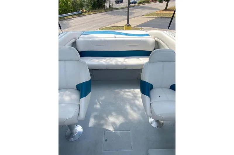 Slide: The Image of 1996 Crownline 266 BR boat interior with white and blue seating. - 6
