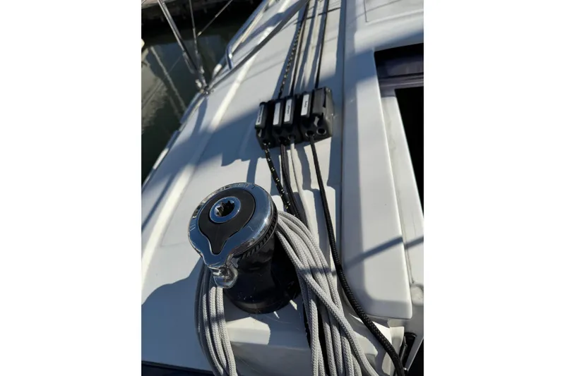 Slide: The Image of Winch and ropes on 2020 Beneteau Oceanis 30.1 sailboat deck. - 11