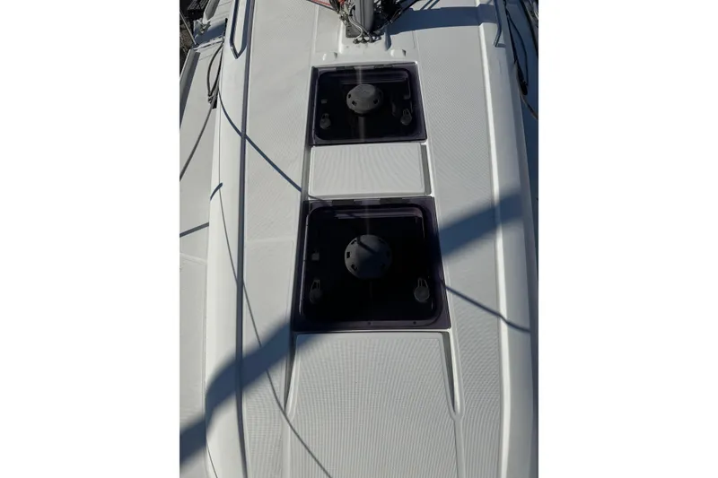 Slide: The Image of Beneteau Oceanis 30.1 deck view, 2020 model, featuring dual hatches and sleek design. - 13