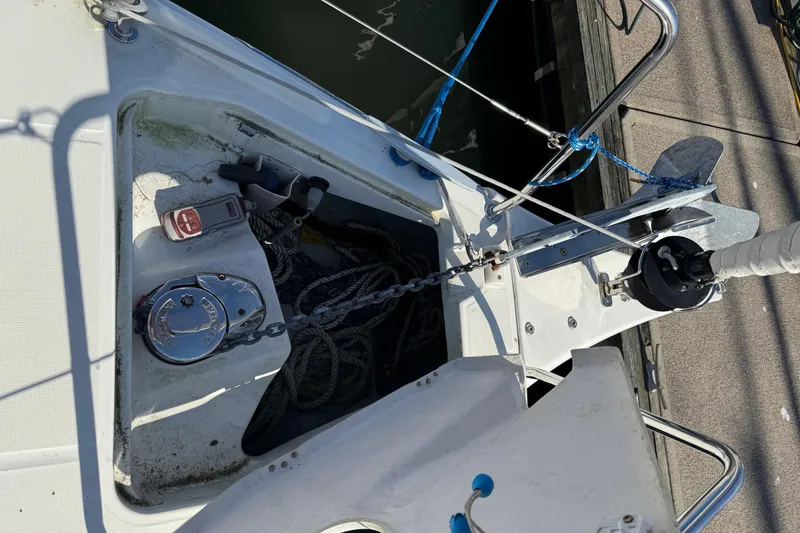Slide: The Image of Beneteau Oceanis 30.1 sailboat anchor system, 2020 model, docked with visible ropes and winch. - 15