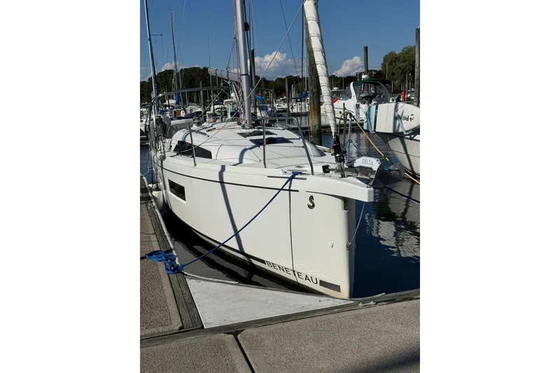 Slide: The Image of 2020 Beneteau Oceanis 30.1 sailboat docked at marina under clear sky. - 2