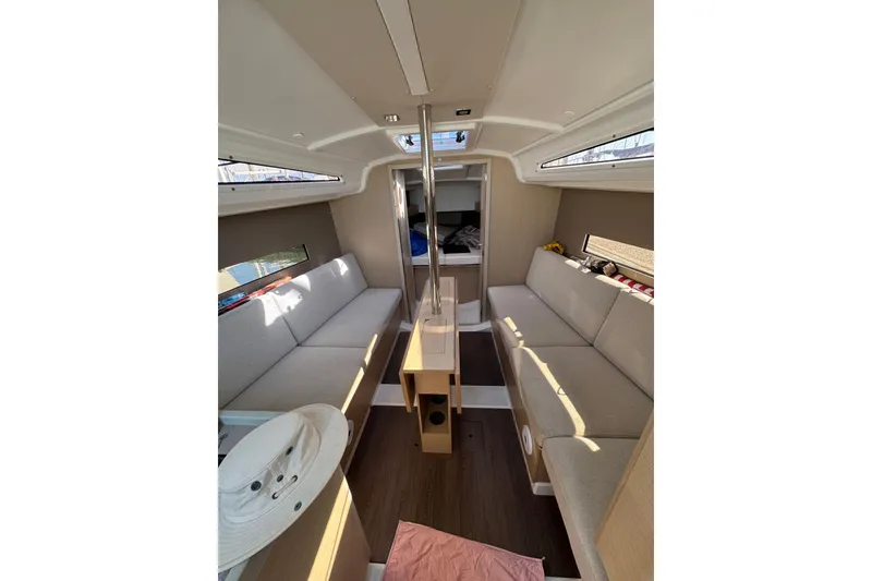 Slide: The Image of Interior of 2020 Beneteau Oceanis 30.1 sailboat with cozy seating and modern design. - 20
