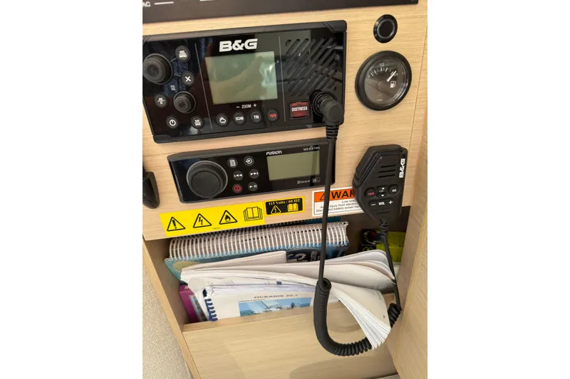Slide: The Image of Control panel of a 2020 Beneteau Oceanis 30.1 sailboat with navigation equipment. - 28