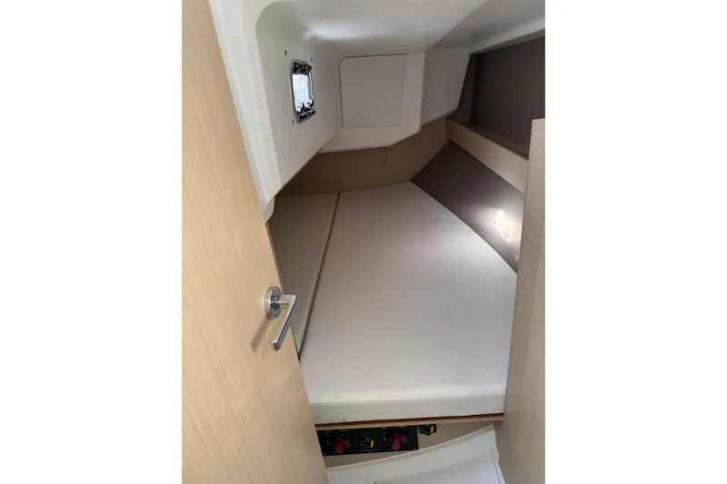 Slide: The Image of Interior cabin of 2020 Beneteau Oceanis 30.1 yacht, featuring a cozy sleeping area. - 29