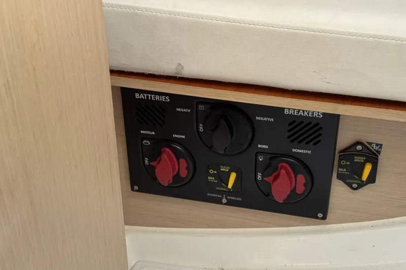 Slide: The Image of Control panel of a 2020 Beneteau Oceanis 30.1 yacht, featuring battery and breaker switches. - 32