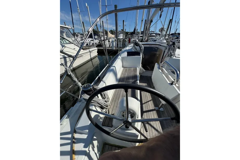 Slide: The Image of Beneteau Oceanis 30.1 sailboat cockpit view, 2020 model, docked in marina. - 4