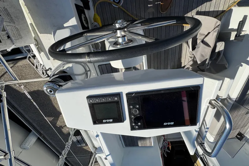 Slide: The Image of Steering wheel and navigation system on 2020 Beneteau Oceanis 30.1 sailboat. - 5