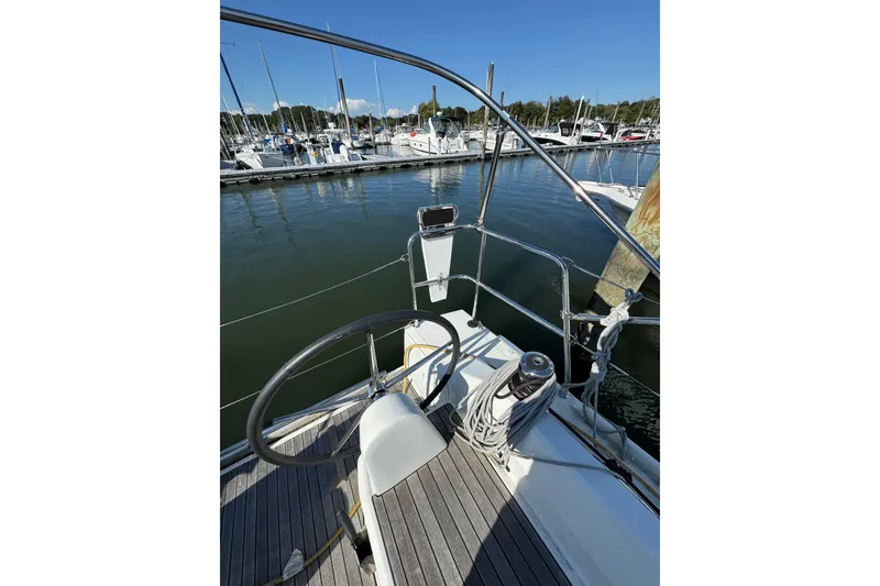Slide: The Image of Cockpit view of 2020 Beneteau Oceanis 30.1 sailboat docked at marina. - 6