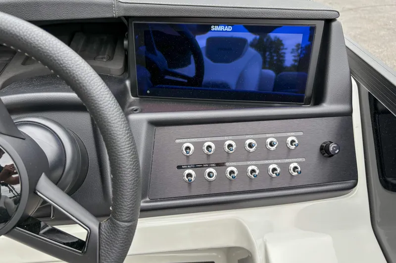 Slide: The Image of Dashboard of Alera M23Q 2026 with Simrad display and control switches. - 10
