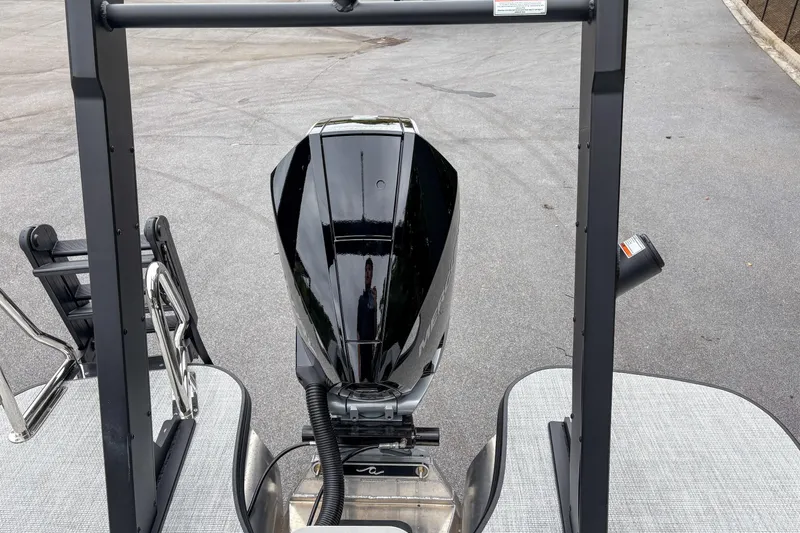 Slide: The Image of Alera M23Q 2026 boat motor on a docked pontoon, showcasing sleek design. - 13