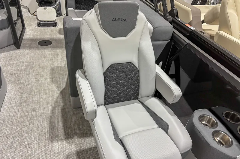 Slide: The Image of Alera M23Q 2026 boat seat with gray and white upholstery, featuring cup holders. - 14