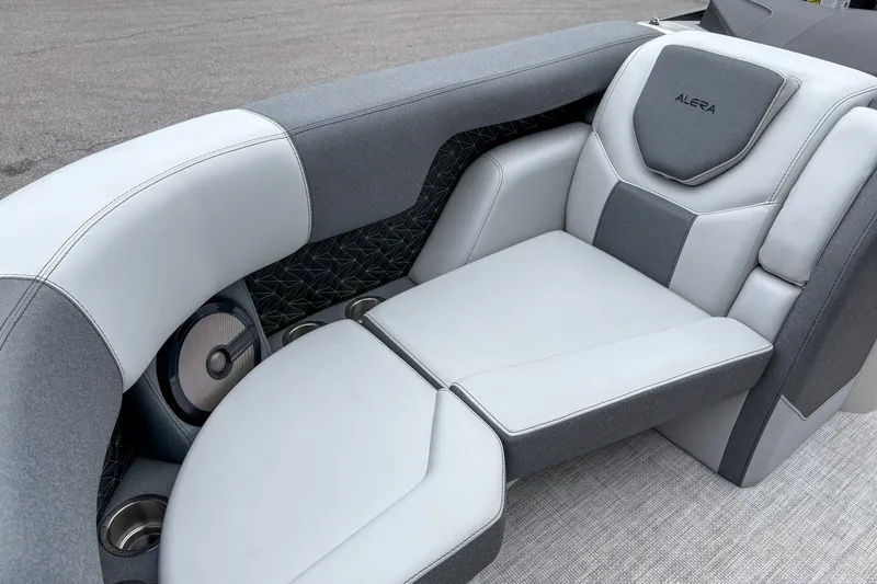 Slide: The Image of Luxurious seating in the 2026 Alera M23Q boat, featuring sleek gray and white upholstery. - 4