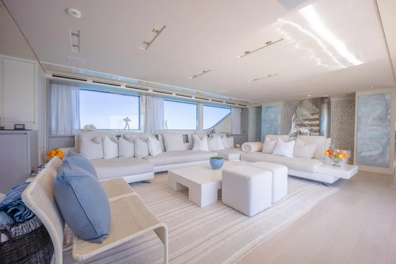 Slide: The Image of Luxurious interior of 2019 Sanlorenzo SD112 yacht with modern white furnishings and large windows. - 12