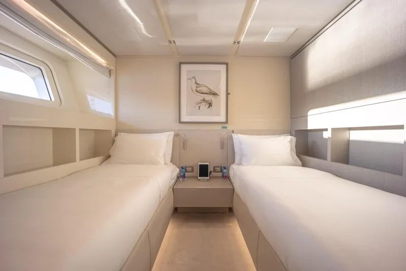 Slide: The Image of Luxurious twin cabin on 2019 Sanlorenzo SD112 yacht, featuring modern decor and natural light. - 31