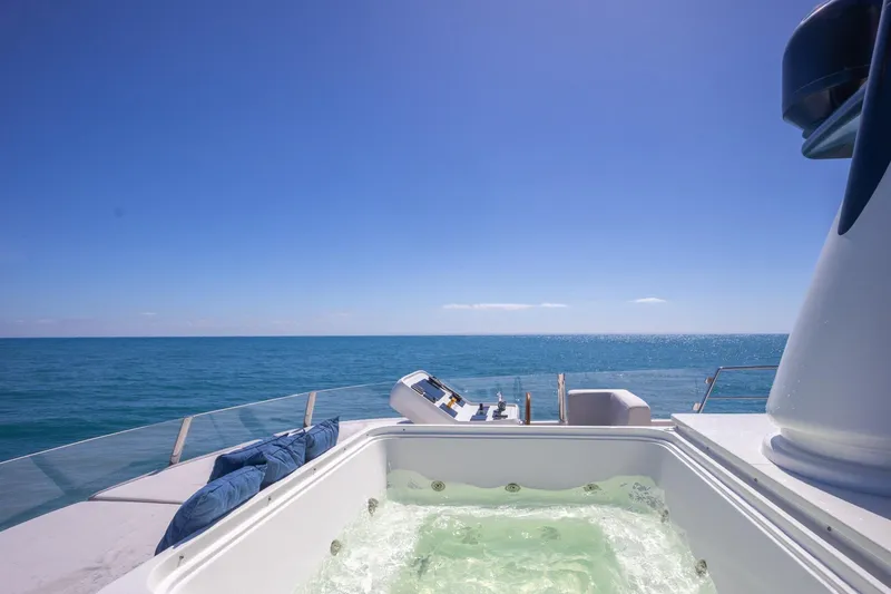 Slide: The Image of Luxurious Sanlorenzo SD112 yacht with jacuzzi, ocean view, and clear blue sky. - 43