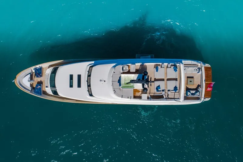 Slide: The Image of Aerial view of 2019 Sanlorenzo SD112 yacht on turquoise water. - 7