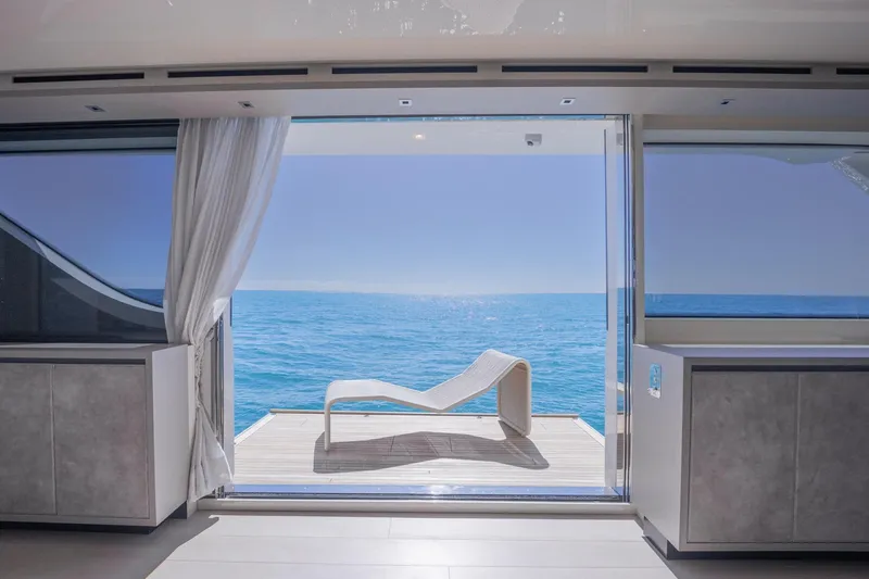 Slide: The Image of Luxurious Sanlorenzo SD112 yacht interior with ocean view and modern lounge chair, 2019 model. - 8