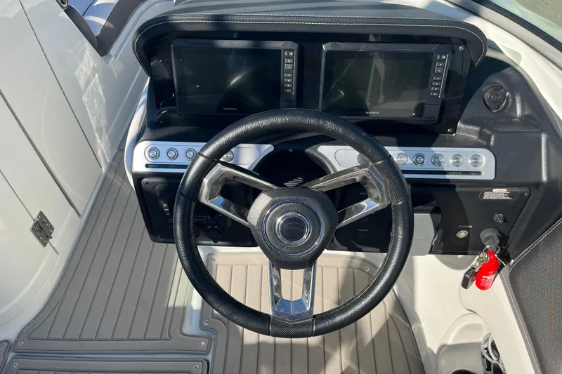Slide: The Image of Steering wheel and dashboard of 2026 Crownline Eclipse E235 boat. - 15