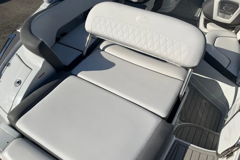 Slide: The Image of 2026 Crownline Eclipse E235 boat interior with cushioned seating and modern design. - 6