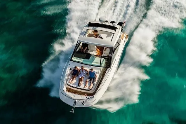 Slide: The Image of Manufacturer Provided Image: 2020 Sea Ray Sundancer 320 OB cruising on clear turquoise waters. - 19