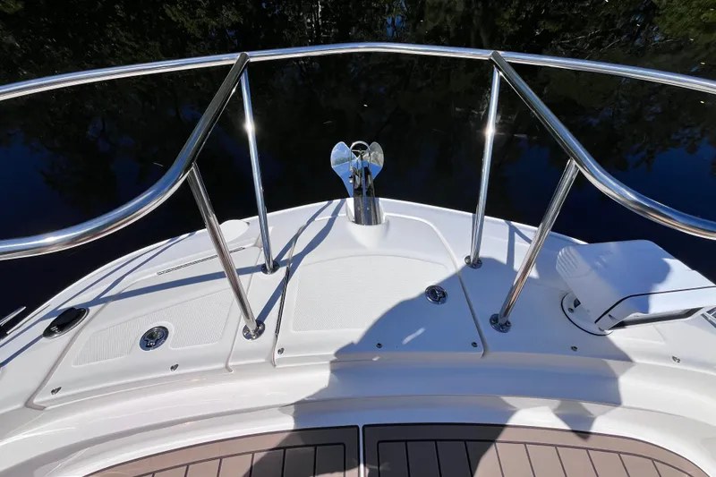 Slide: The Image of Bow view of 2020 Sea Ray Sundancer 320 Outboard with stainless steel railings. - 27