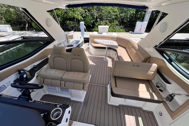 Slide: The Image of Luxurious interior of 2020 Sea Ray Sundancer 320 Outboard with elegant seating and helm. - 30