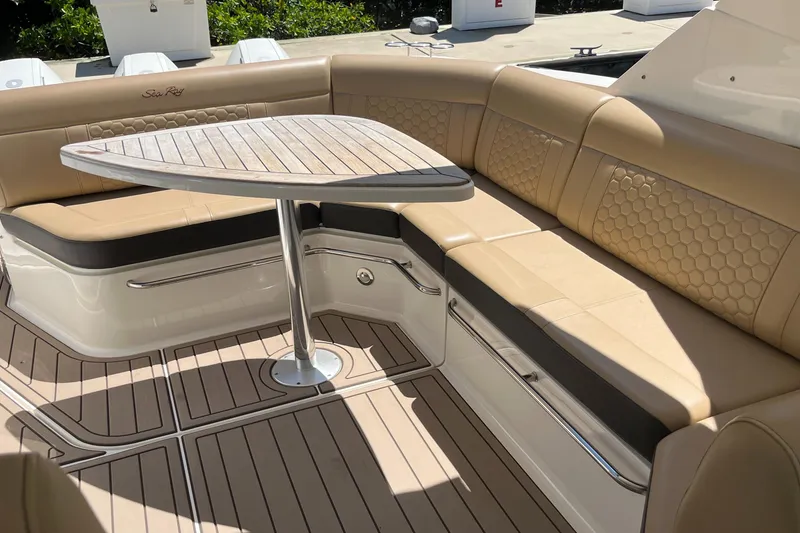Slide: The Image of Luxurious seating area on 2020 Sea Ray Sundancer 320 Outboard with elegant table and upholstery. - 33
