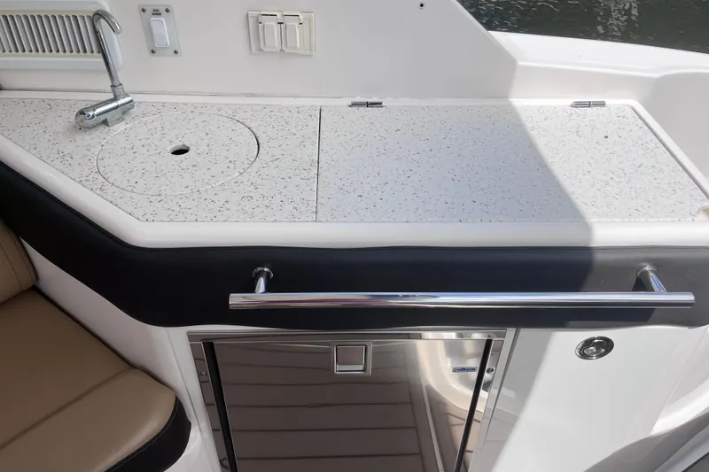 Slide: The Image of 2020 Sea Ray Sundancer 320 Outboard boat kitchenette with sink and countertop. - 41