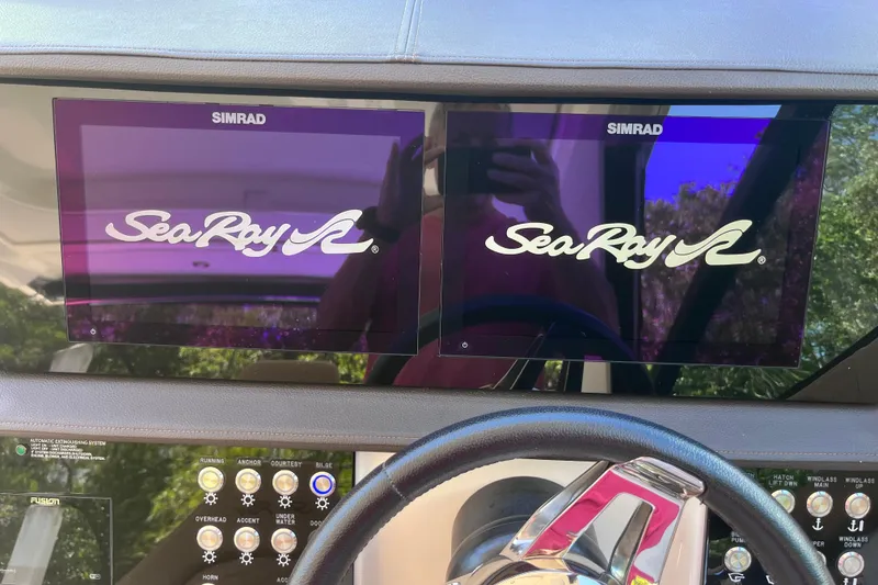 Slide: The Image of Dashboard of 2020 Sea Ray Sundancer 320 Outboard with dual Simrad displays. - 47