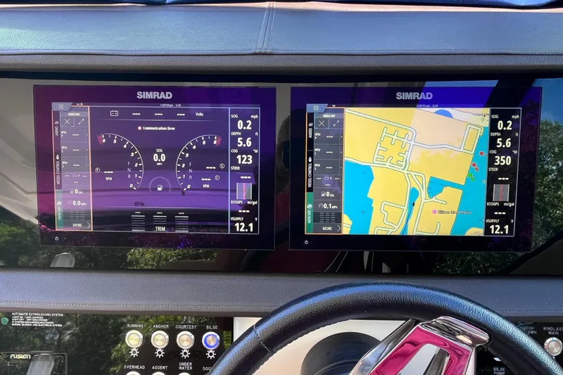 Slide: The Image of Dashboard of 2020 Sea Ray Sundancer 320 Outboard with Simrad navigation displays. - 49