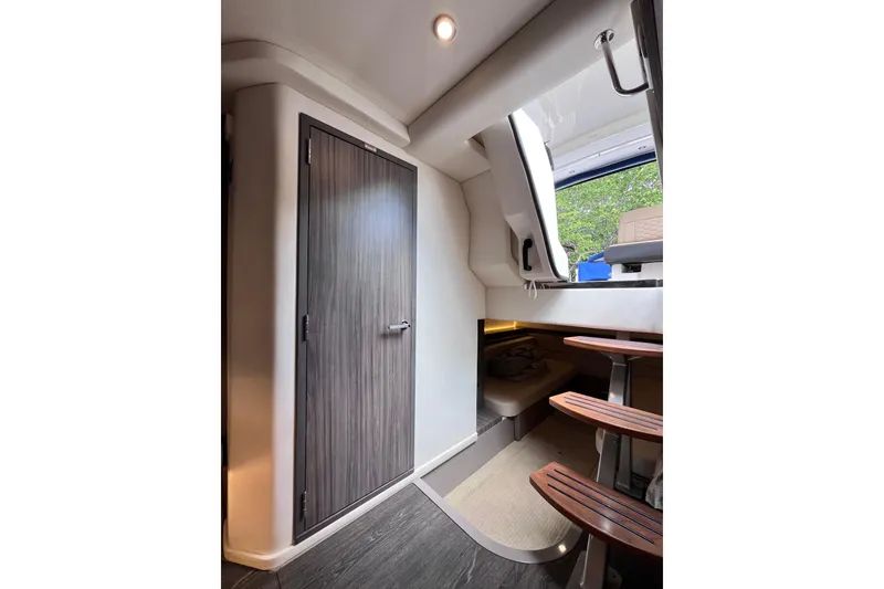 Slide: The Image of Interior of 2020 Sea Ray Sundancer 320 Outboard, featuring modern design and wooden accents. - 51