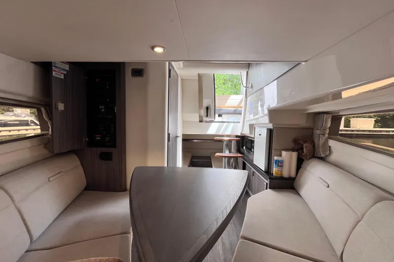 Slide: The Image of Interior of 2020 Sea Ray Sundancer 320 Outboard, featuring cozy seating and modern amenities. - 55