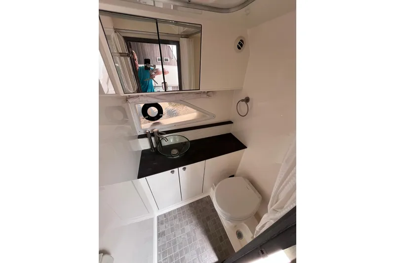 Slide: The Image of 2020 Sea Ray Sundancer 320 Outboard bathroom with modern fixtures and compact design. - 62