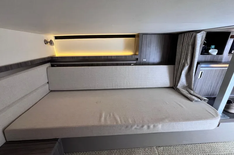 Slide: The Image of 2020 Sea Ray Sundancer 320 Outboard interior cabin with modern seating and ambient lighting. - 68