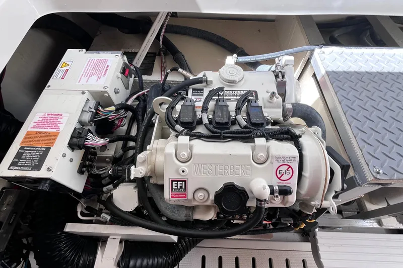 Slide: The Image of Engine compartment of a 2020 Sea Ray Sundancer 320 Outboard with Westerbeke generator. - 78
