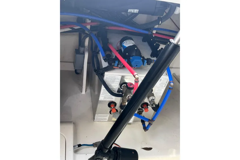 Slide: The Image of 2020 Sea Ray Sundancer 320 Outboard engine compartment with wiring and components. - 82